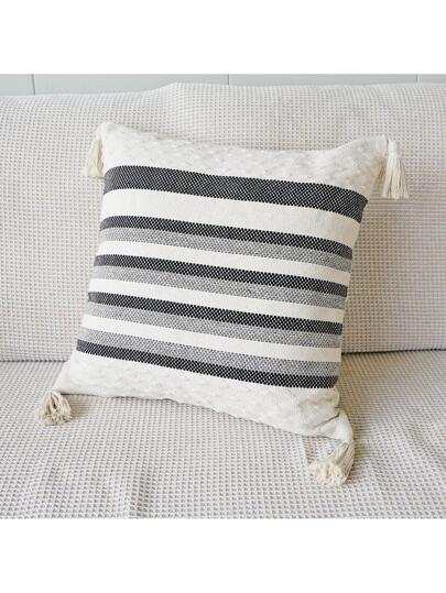 black and grey striped cushion with a white background, tassels on each corner and a textured feel on the bottom and top