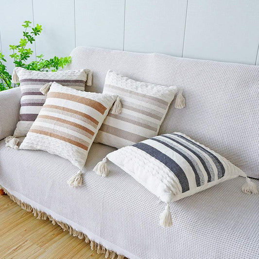 Ambient Striped Cushion with tassels on each corner as well as a textured pattern on the top and bottom