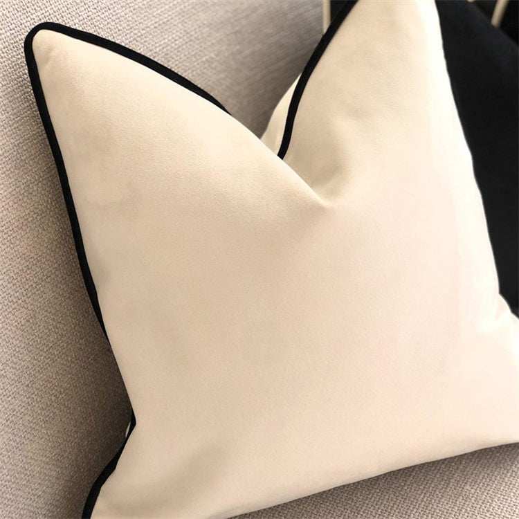 white velvet cushion with black piping in a classy and sophisticated look showing affordable luxury