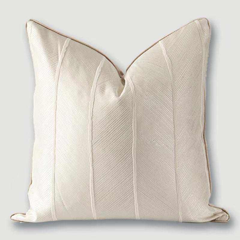 White with white stripes running down this affordable luxury cushion with leaf rugged pattern on the cushion
