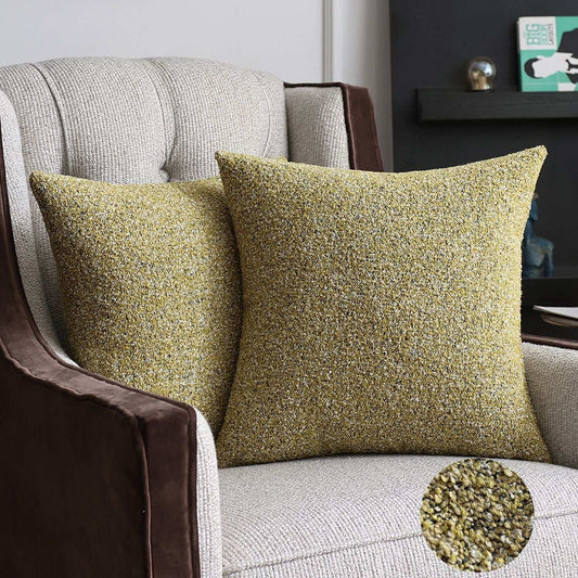 Yellow cream corduroy patchworks cushion on a arm chair showing versatility and freshness scatter cushions bring to any room